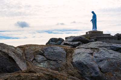 A statue of Mary overlooks the tiny fishing village of Trinity, Nfld.