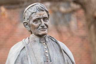 A statue of St. John Henry Newman stands on the campus of Newman University in Wichita, Kan., just one of many colleges across North America that has incorporated his name and  work into their institutions.