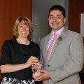 Education Minister Laurel Broten presents the Premier’s Award for Excellence in Leadership to principal Mark Cassar.