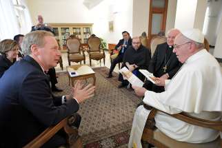 Pope Francis meets with Brad Smith, president and chief legal officer of Microsoft, at Domus Sanctae Marthae at the Vatican Feb. 13, 2019. 