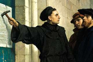 Martin Luther hammers his 95 theses on a church door, as depicted by Belgian painter Ferdinand Eauwels, an act that prompted the Reformation 500 years ago. 