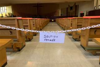 A sign reads &quot;closed section&quot; at St.-Benoît-Abbé&#039;s church in Quebec City.