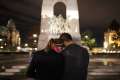 A couple embraces at the foot of the National War Memorial in Ottawa, Ontario, Oct. 23. Cpl. Nathan Cirillo, a Canadian soldier, was shot and killed the previous day while on duty at the nearby National War Memorial.