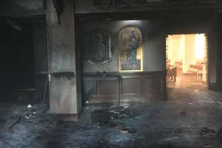 Queen of Peace Catholic Church in Ocala, Fla., is seen July 13, 2020, after it was set ablaze by a suspect who drove his van through the front doors two days earlier.