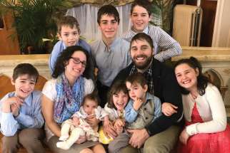 The Sullivan family, Patrick and wife Kyra, with eight of their nine children.