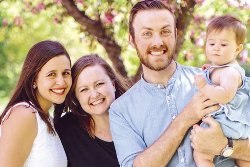 Megan Turland, left, with fellow blogger Laura- Anne Smid, husband Ben and her daughter. 