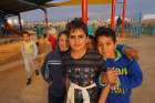 Syrian refugee children pose for a photo Jan. 14 in a child-friendly space created by Mercy Corps inside the Zaatari Refugee Camp in Jordan, near the Syrian border.
