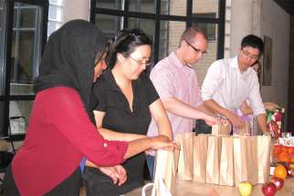 A past Muslim-Catholic Student Dialogue group preparing sandwiches to give to the homeless.