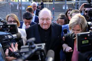 Archbishop Philip Wilson of Adelaide, Australia, leaves the Newcastle Local Court May 22. Archbishop Wilson, who was convicted of covering up clergy sexual abuse, says he will consult his lawyer before he decides next steps. 