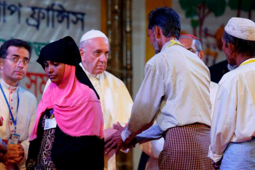Pope Francis meets Rohingya refugees from Myanmar during an interreligious and ecumenical meeting for peace in the garden of the archbishop&#039;s residence in Dhaka, Bangladesh, Dec. 1. 