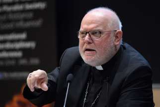 At a news conference Feb. 15, German Cardinal Reinhard Marx says, despite tensions within the Church, Pope Francis has full support of his senior cardinals.