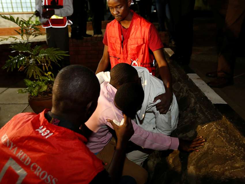 Kenya Red Cross staff members console relatives of the civilians killed in an attack at the Bisharo lodging by Islamist militants from the Somali group al-Shabab in Mandera, at the Chiromo mortuary in Kenya’s capital, Nairobi, on Oct. 25, 2016.