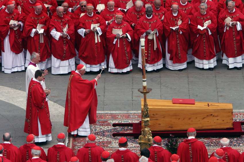 German Cardinal Joseph Ratzinger, the future Pope Benedict XVI, sprinkles holy water on the casket of Pope John Paul II during his funeral Mass in St. Peter&#039;s Square at the Vatican in this April 8, 2005, file photo.