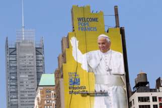 A nearly 70-metre tall mural featuring an image of Pope Francis nears completion in New York City Sept. 1. The artwork was commissioned by DeSales Media Group, the communications and technology arm of the Diocese of Brooklyn, N.Y.