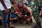 Rohingya refugees wait to receive aid Sept. 27 at a camp in Cox&#039;s Bazar, Bangladesh. 