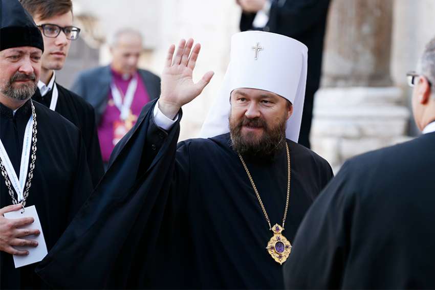 Metropolitan Hilarion of Volokolamsk, head of external relations for the Russian Orthodox Church, waves as he arrives at the Basilica of St. Nicholas in Bari, Italy, July 7.