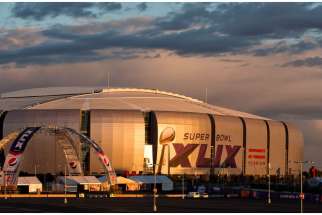 University of Phoenix Stadium in Glendale, Ariz., seen Jan. 21, is readied for Super Bowl XLIX, the Feb. 1 match between the Seattle Seahawks and the New England Patriots. Catholic Charities of Arizona is preparing to serve an increased number of sex-tra fficking victims arrested by local police in the days surrounding Super Bowl Sunday.