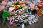 Children&#039;s shoes line a memorial on the grounds of the former Kamloops Indian Residential School June 6, 2021. The remains of 215 children, some as young as 3 years old, were found at the site in May in Kamloops, British Columbia.