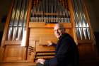 Msgr. Vincenzo De Gregorio, director of the Pontifical Institute of Sacred Music, is pictured at an organ at the institute in Rome Dec. 6. Msgr. De Gregorio said the Catholic Church tries to make music accessible to the congregation so everyone can participate.