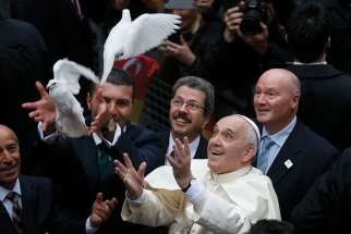 Pope Francis releases doves, a traditional sign of peace, prior to celebrating Mass in 2014 at the Cathedral of the Holy Spirit in Istanbul. 
