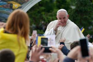 Pope Francis greets the crowd as he arrives for a Marian gathering with young people and families in the square outside the government Palace of Culture in Iasi, Romania, June 1, 2019.
