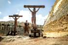 In Risen, a Roman soldier stands before the crucified Christ. Joseph Fiennes’ character undergoes a transformation as he leads the manhunt for Christ’s body after the Resurrection.