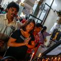 People pray near a crucifix during Mass Nov. 24 in the damaged Basilica of the Holy Child in Tacloban, Philippines. Super Typhoon Haiyan, the most powerful storm to make landfall this year, bamaged the basilica when it struck the central Philippines Nov. 8, killing thousands and displacing more than 4 million people.