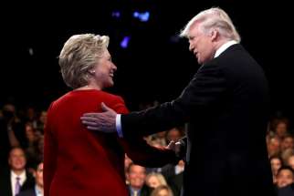 U.S. Presidential nominees Donald Trump and Hillary Clinton greet each other at the start of their first presidential debate Sept. 27. A dozen U.S. conservative evangelicals and Catholics posted an open letter that same day criticizing the “liberal political agenda,” which specifically named Clinton.