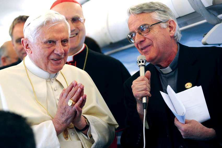 Pope Benedict XVI listens to Jesuit Father Federico Lombardi, the Vatican spokesman, on a flight to Portugal in this May 11, 2010, file photo. Lombardi said Pope Benedict has never attempted to hide what is true, no matter how painful recognizing reality would be.