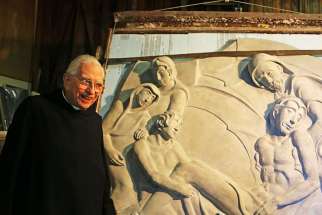 Fr. Dunstan Massey and his nearly-complete bas-relief of Christ&#039;s burial.