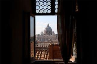 The dome of St. Peter&#039;s Basilica at the Vatican is seen through a window of Castel Sant&#039;Angelo in Rome in this 2018 file photo. A Canadian Indigenous delegation will be meeting with Pope Francis at the Vatican beginning March 28.