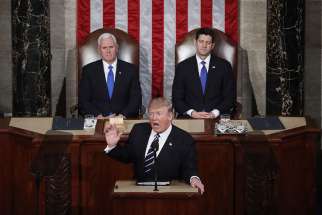Vice President Mike Pence and U.S. House Speaker Paul Ryan, R-Wis., look on as President Donald Trump delivers his first address to a joint session of Congress Feb. 28 in Washington.