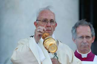 ope Francis celebrates Mass on the feast of Corpus Christi June 18 outside Rome&#039;s Basilica of St. John Lateran.