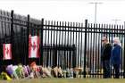 A makeshift memorial appeared at the Royal Canadian Mounted Police headquarters in Dartmouth, N.S., April 20, a day after a man went on a 13-hour rampage that left 22 dead.