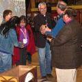 Anglican and Catholic bishops exchange good wishes at a ceremony of reconciliation on the second day of the Truth and Reconciliation Commission of Canada Northern National Event Tuesday.