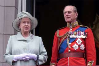 Britain&#039;s Queen Elizabeth II and Prince Philip, Duke of Edinburgh, are pictured standing on the balcony of London&#039;s Buckingham Palace June 16, 2001. Prince Philip, the longest-serving consort of any British monarch, died April 9, 2021, at age 99, Buckingham Palace said.