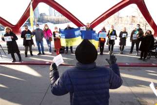 Supporters of Ukrainian sovereignty hold a protest on the Peace Bridge in Calgary Jan. 22.