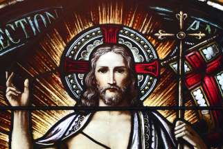 The risen Christ is depicted in a stained-glass window at St. Aloysius Church in Great Neck, N.Y.