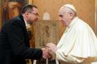 Pope Francis shakes hand with Ukraine&#039;s ambassador to the Holy See, Andrii Yurash, during a private audience at the Vatican April 7, 2022. After meeting with Pope Francis Aug. 6, Yurash said the pope planned on visiting the war-torn country before his visit to Kazakhstan in September.