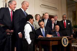 President Obama signs the Patient Protection and Affordable Care Act at the White House on March 23, 2010.