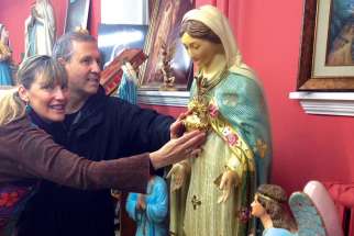 Angelina and Dennis Girard see the replica of Our Lady of the Cape, Queen of Canada, that had been processed from the Shrine at Cap-de-Madeleine to Ottawa for the historical Marian Congress of 1947.