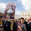 Australian pilgrims hold a banner showing new Australian St. Mary MacKillop in St. Peter&#039;s Square at the Vatican Oct. 17. Pope Benedict XVI named six new saints during the Mass of canonization.