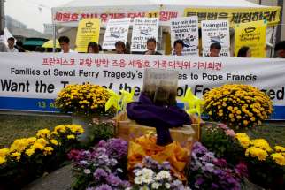 Family members of the 304 South Korean ferry victims send Pope Francis a message from Seoul, South Korea, Aug. 13. The pope is scheduled to be in the country for a five-day Asian Youth Day event.