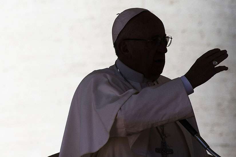  silhouette of Pope Francis is seen in St. Peter&#039;s Square at the Vatican Feb. 20. For a Christian, talk is cheap; the faith requires concretely doing God&#039;s will and serving the least as well as those around you, Pope Francis said at his morning Mass Feb. 23.