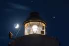Saturn is seen shining above the Cape Murro di Porco Lighthouse in Syracuse, Sicily, and Jupiter is seen shining to the right, in this photo taken in November. The two largest planets in the solar system will pass so close together Dec. 21 it has given rise to talk about the “Christmas Star.”
