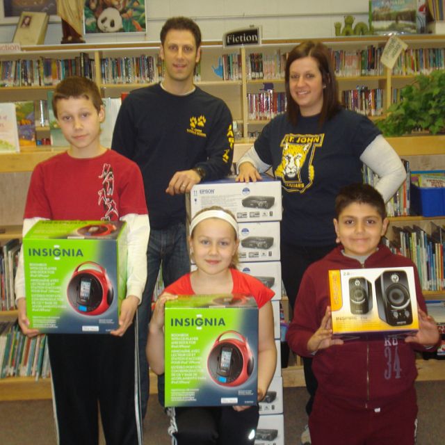 Poetic teachers Mike Maiorano and Michelle Lavey (back row) show off some of the St. John&#039;s newest equipment with the help of Jason Mannella, Grade 5, Mya Chamber, Grade 5 and Dante Salvatori, Grade 4 (left to right).