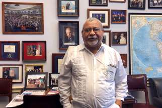 Jesuit Father Ismael Moreno waits in the office of Georgia Congressman Henry &quot;Hank&quot; Johnson at the U.S. Capitol May 17 before a news conference. The Honduran priest, better known as Father Melo, met in mid-May with U.S. lawmakers about stopping military aid to the Central American country.