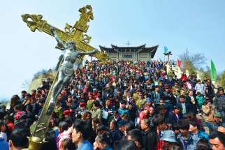 To mark the 2013 election of Pope Francis, Chinese Catholics carry a crucifix on Qiku Mountain in Taiyuan, China. A Mass was celebrated at the historic holy place for local believers to pray for newly elected Pope Francis.
