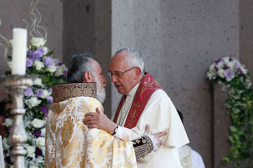 Catholicos Karekin II, patriarch of the Armenian Apostolic Church, exchanges greetings with Pope Francis during a divine liturgy at Etchmiadzin in Vagharshapat, Armenia, June 26.