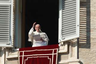 Pope Francis leads the Angelus from the window of his studio overlooking St. Peter&#039;s Square at the Vatican Dec. 20. The pope at his Angelus endorsed a recent U.N. resolution laying out a road map for peace in Syria. 